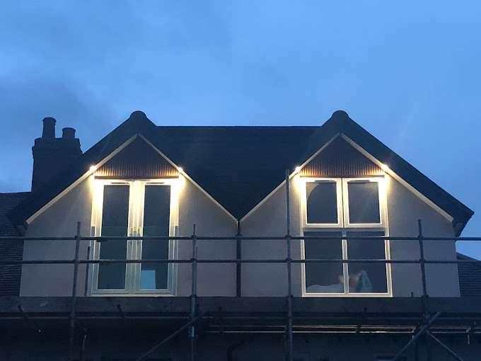 Bromsgrove loft conversion with balcony at night